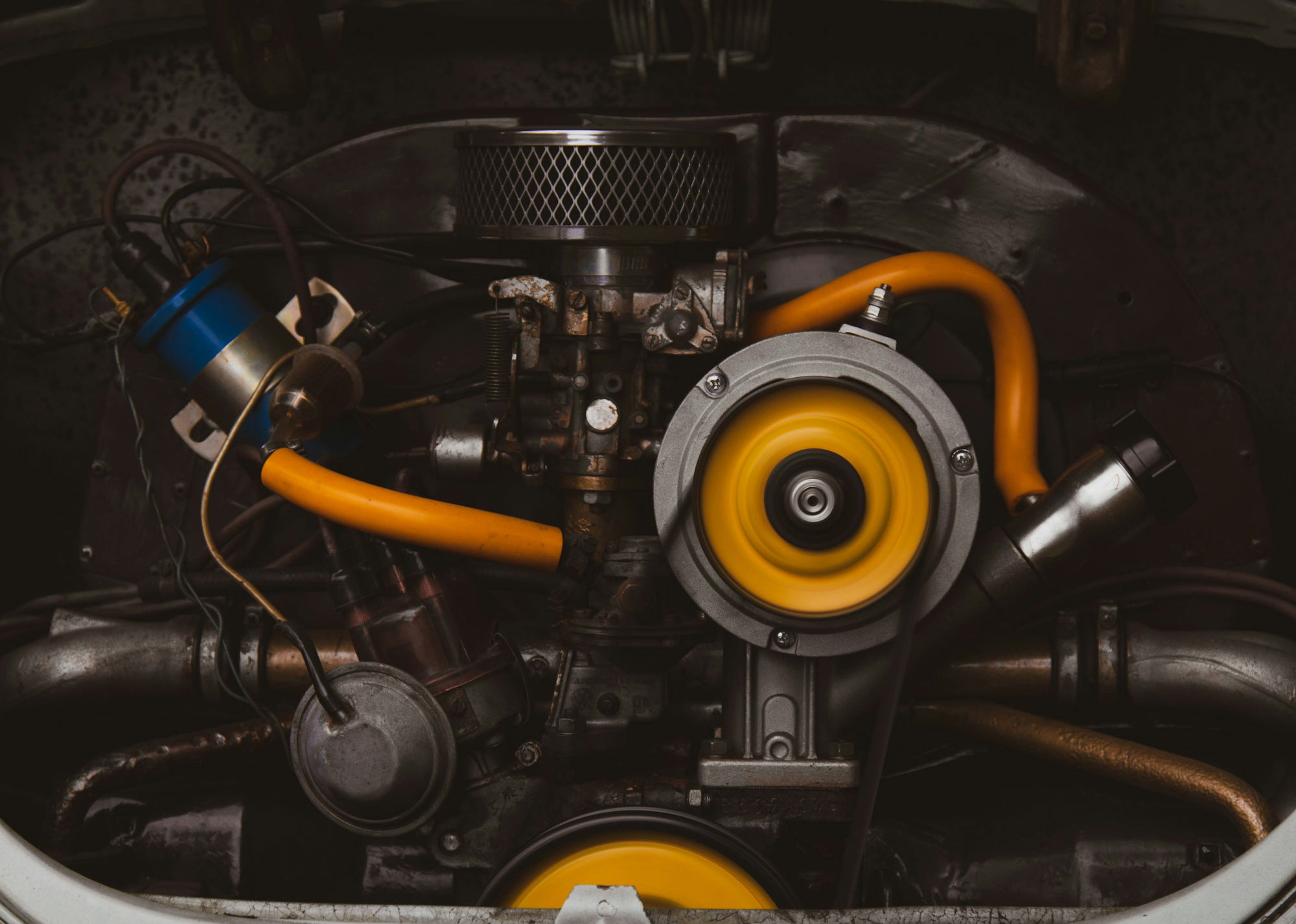 a-close-up-of-a-car-engine-with-yellow-hoses.jpg a close up of a car engine with yellow hoses